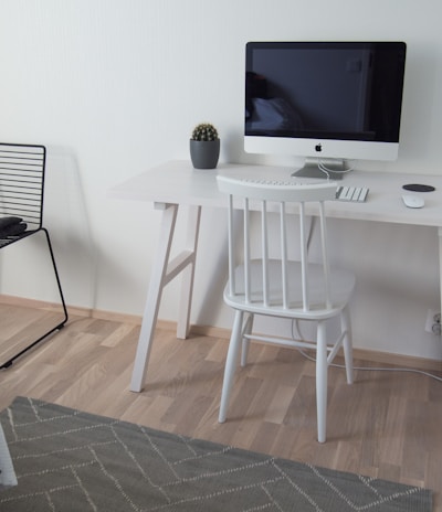 white wooden table with black flat screen tv